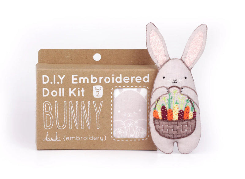 D.I.Y. Embroidered Doll Kit bunny with embroidered basket of carrots on a white background