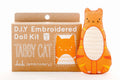 D.I.Y. Embroidered Doll Kit for a tabby cat with packaging on a white background